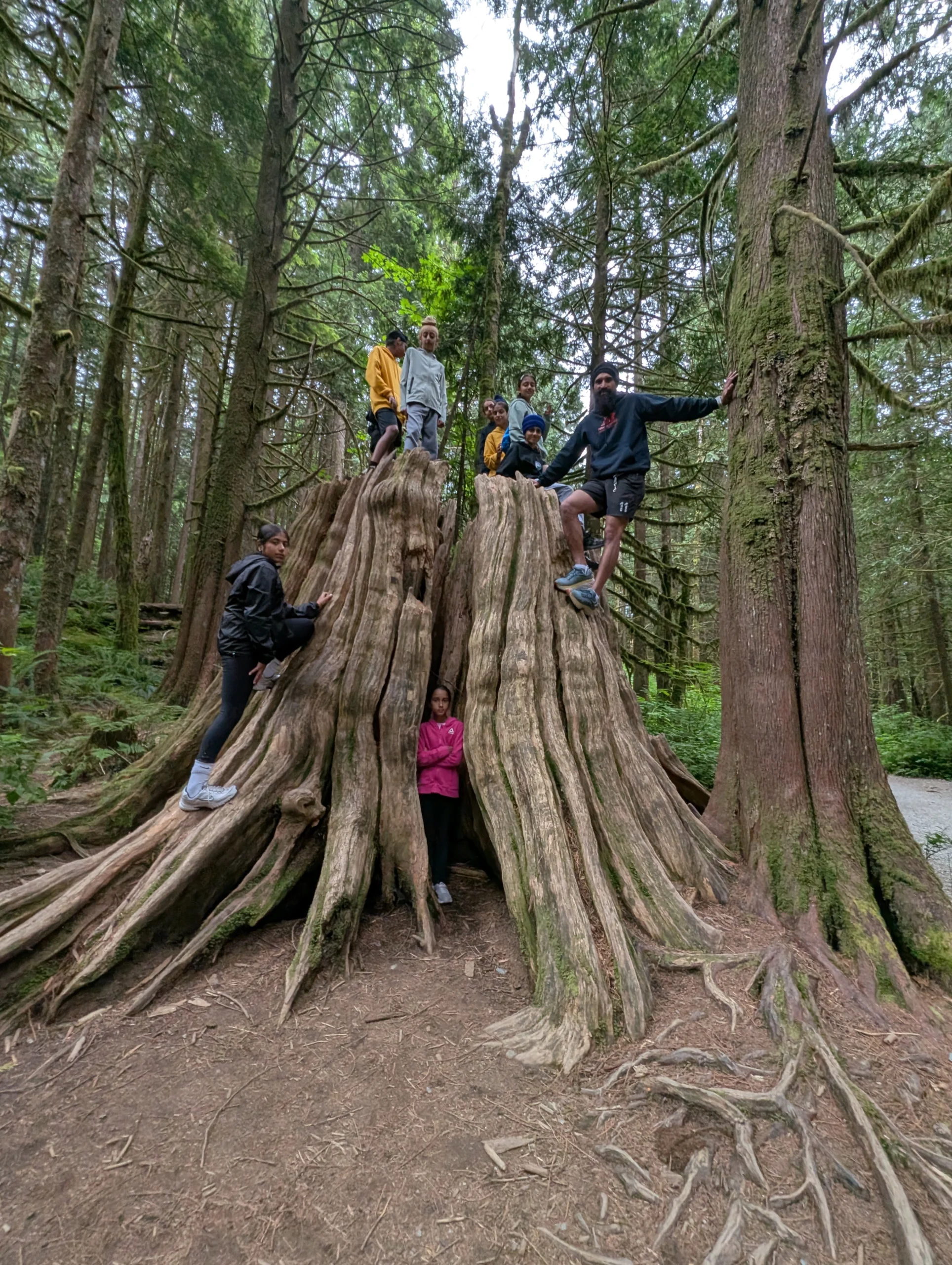 Team sharing laughter along nature path