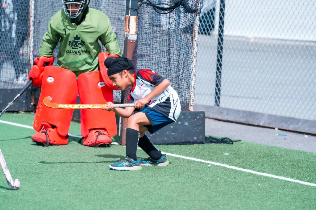 Goalkeeper and defender protecting the goal during competitive play